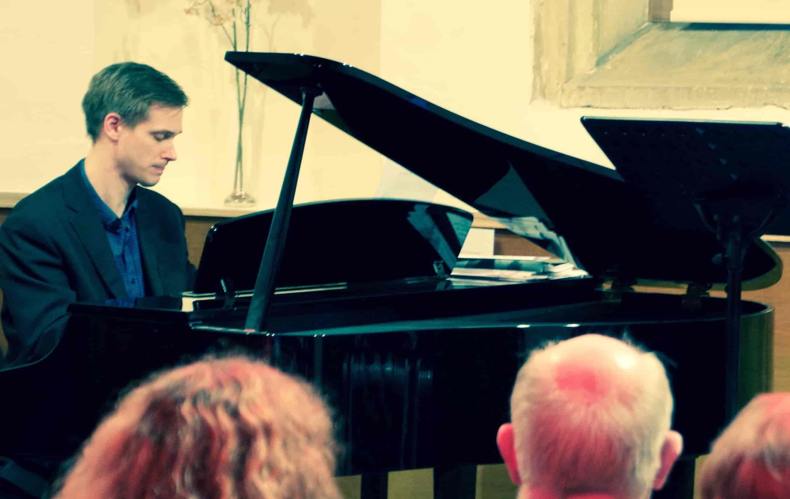 Close up of Joshua at the piano at a recital with Phillippa